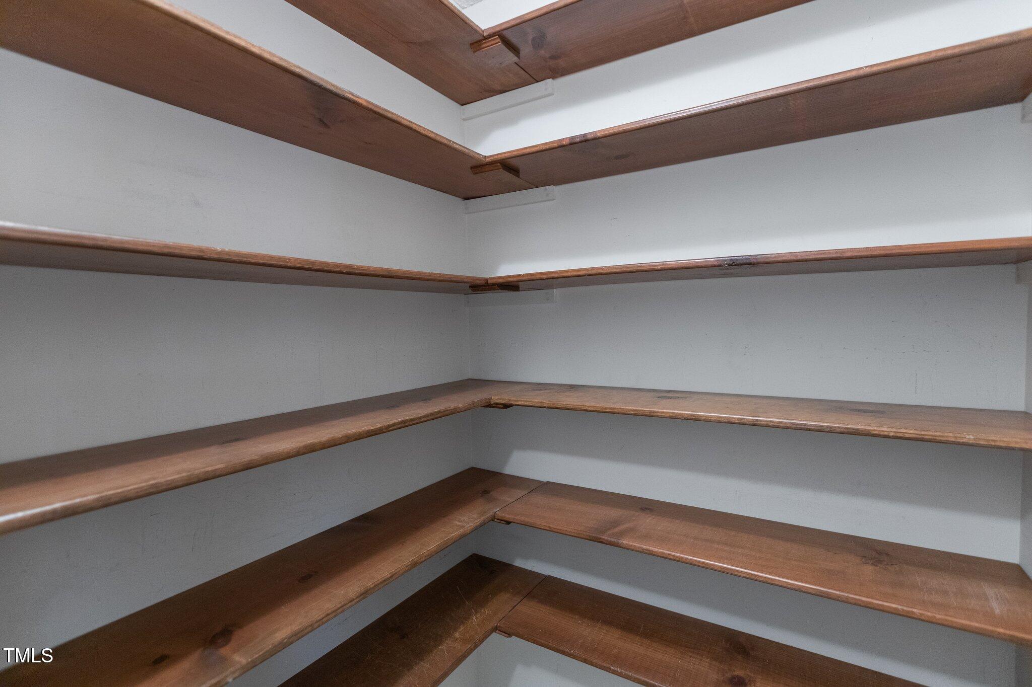 5940 Hampton Ridge Road Raleigh, NC 27603 - Photo 14 of 42 a storage space with racks on the wall