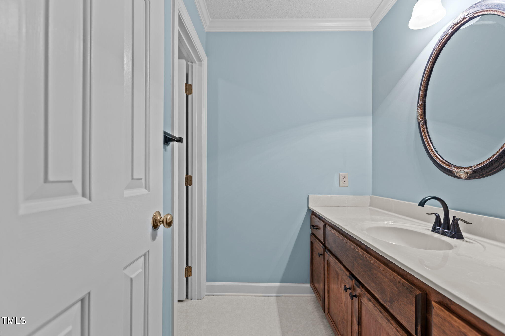 5940 Hampton Ridge Road Raleigh, NC 27603 - Photo 24 of 42 a bathroom with a sink and a mirror