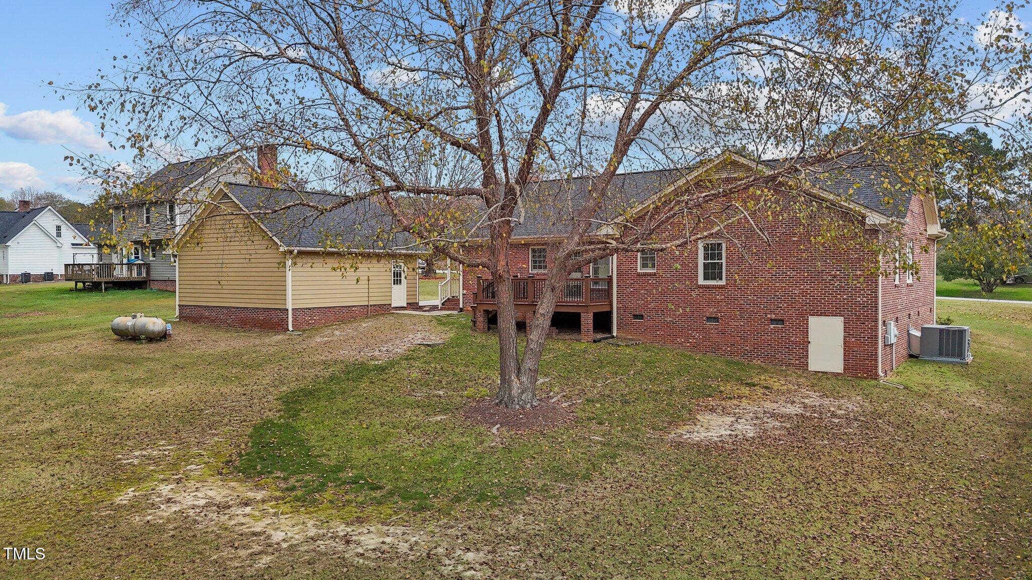 5940 Hampton Ridge Road Raleigh, NC 27603 - Photo 31 of 42 a house that has a tree in front of it