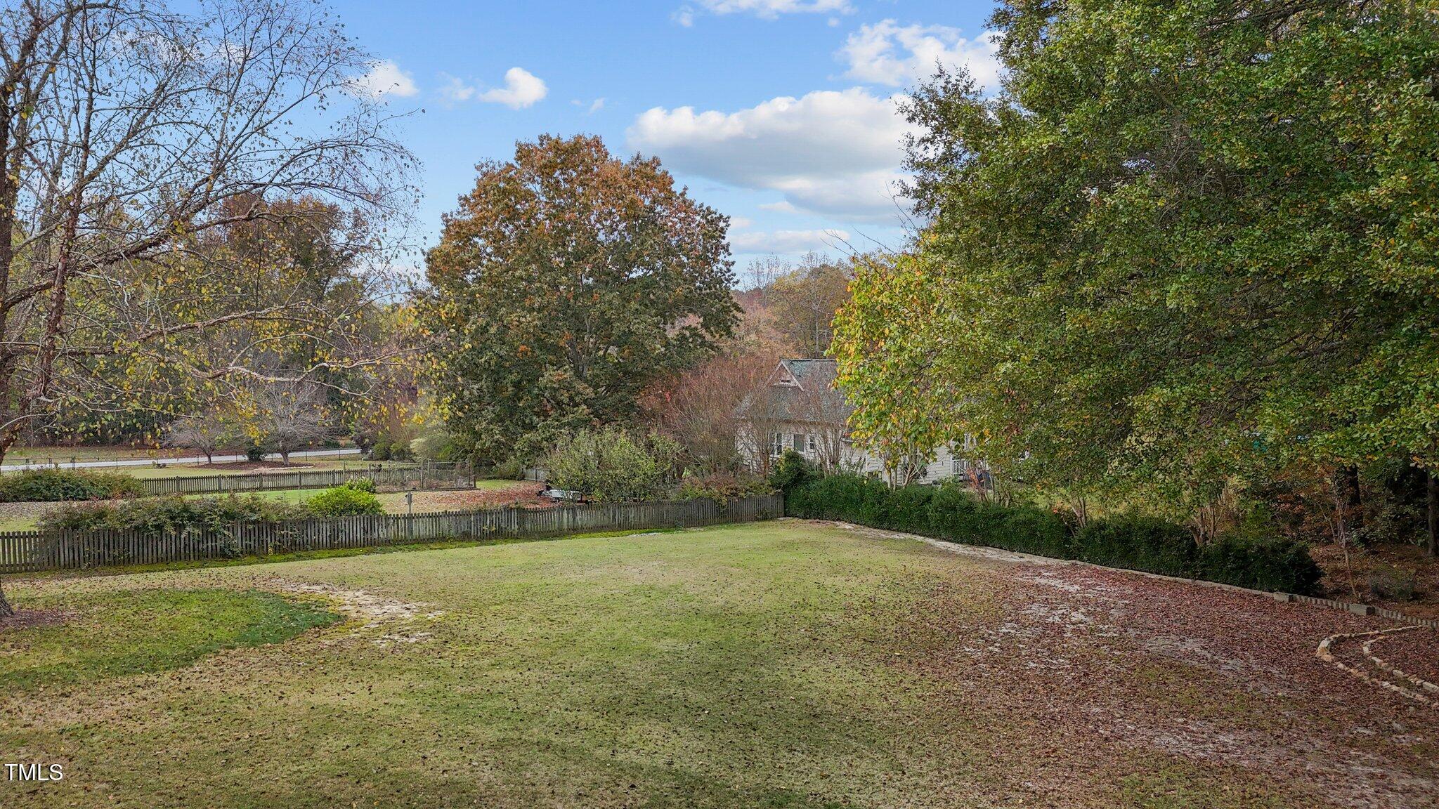 5940 Hampton Ridge Road Raleigh, NC 27603 - Photo 33 of 42 a view of an outdoor space and a yard