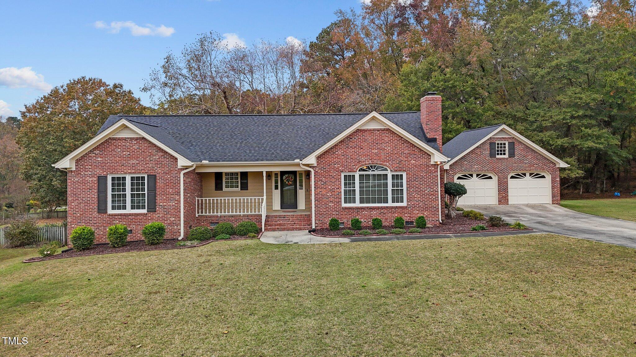 5940 Hampton Ridge Road Raleigh, NC 27603 - Photo 37 of 42 a front view of a house with a yard