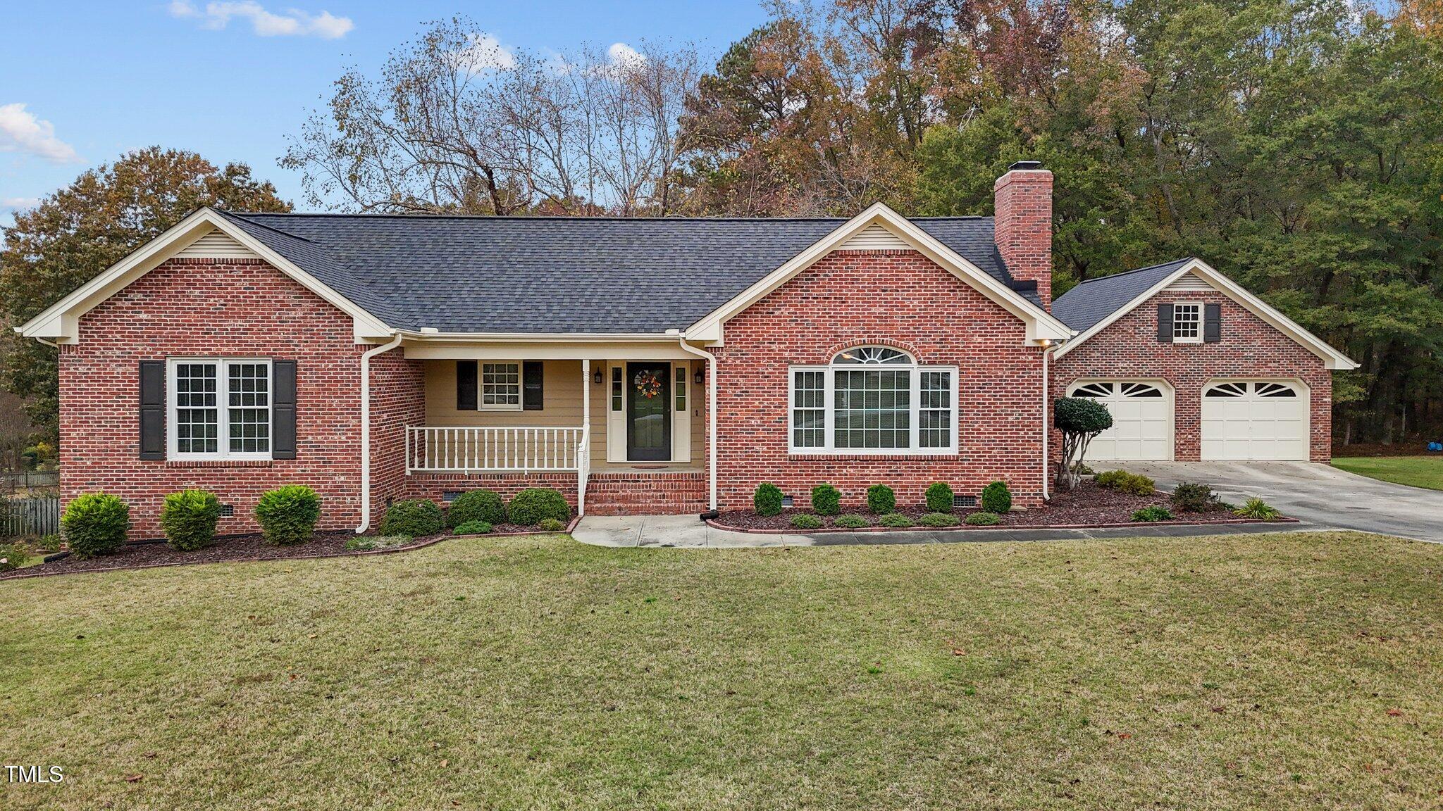 5940 Hampton Ridge Road Raleigh, NC 27603 - Photo 42 of 42 a front view of a house with a yard