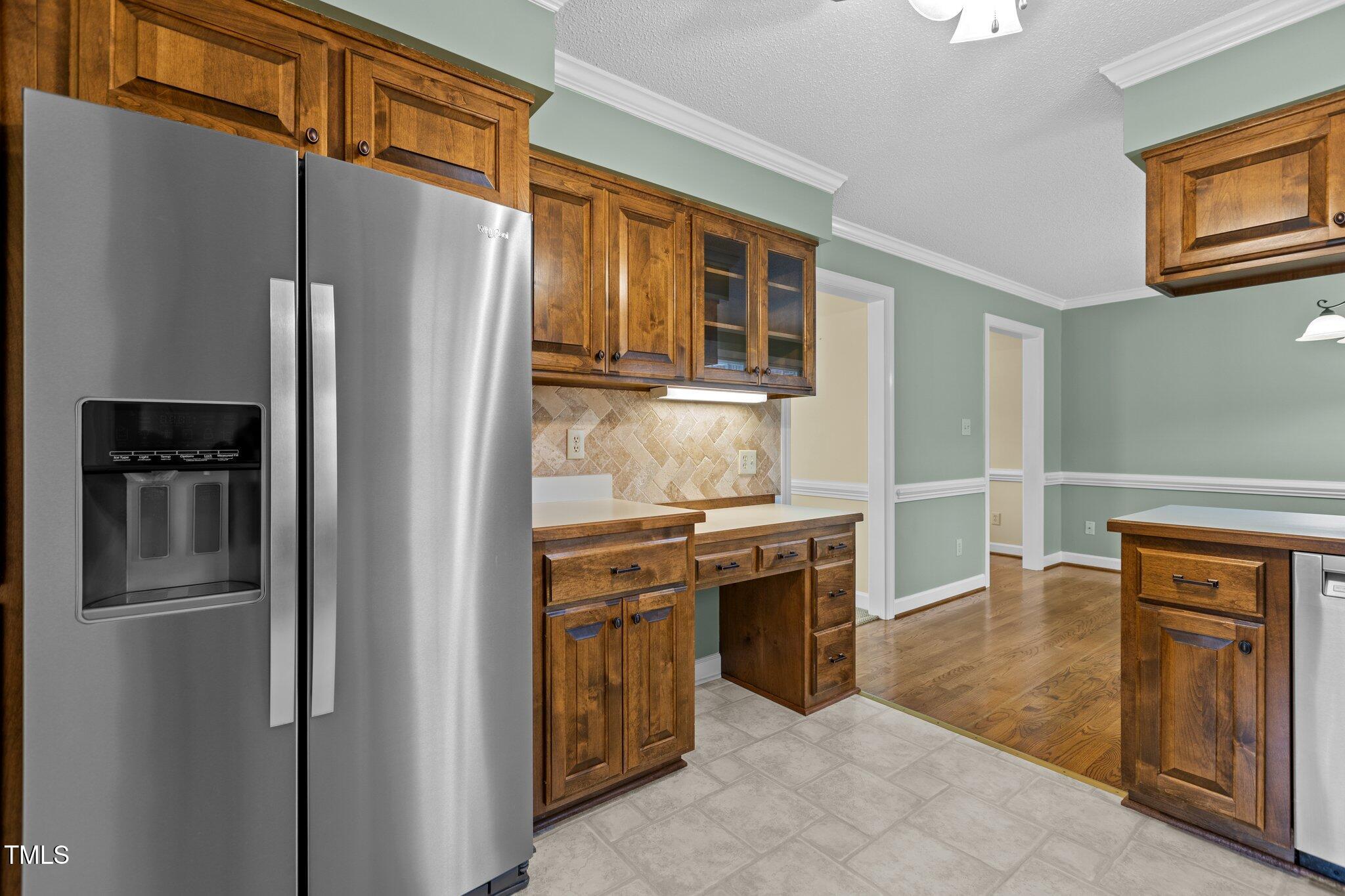5940 Hampton Ridge Road Raleigh, NC 27603 - Photo 9 of 42 a kitchen with stainless steel appliances granite countertop a refrigerator and a stove