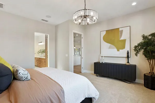 a bedroom with bed and window