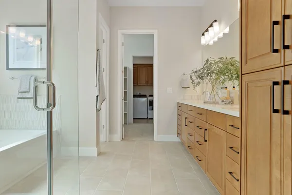 a bathroom with a double vanity sink and mirror