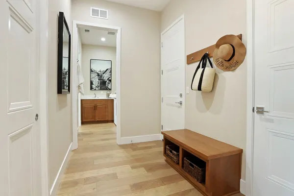 a room with a table and a chandelier