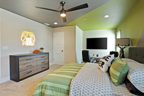 a bed room with a bed and a television