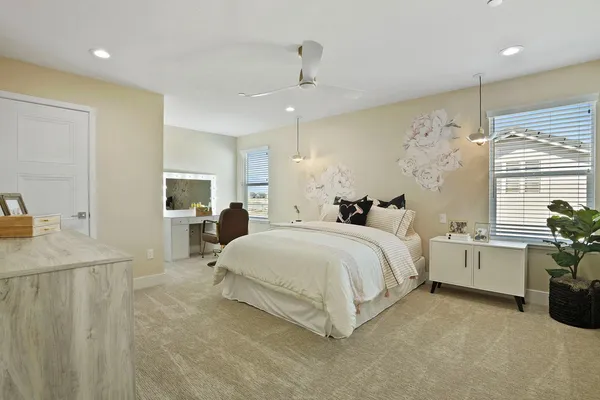 a bed room with furniture and a chandelier