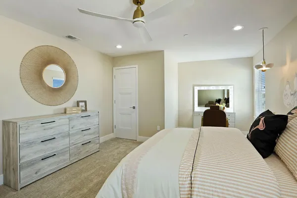 a bedroom with a bed and a dresser
