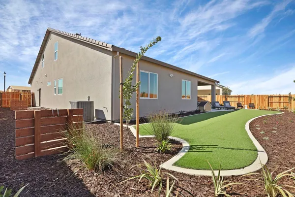 a backyard of a house with garden