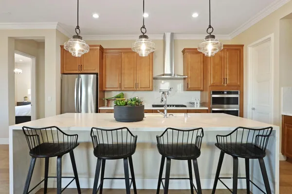 a view of a dining room with furniture and chandelier