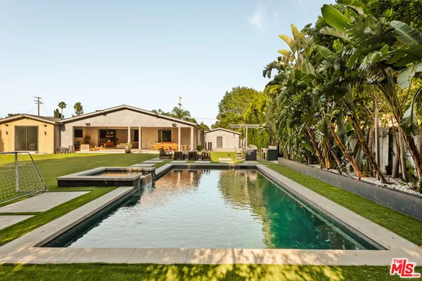 a view of a house with swimming pool