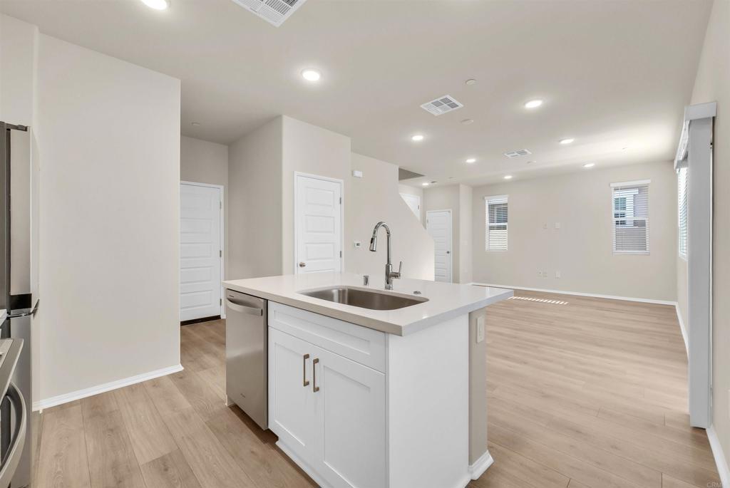 28381 Via Solero Temecula, CA 92591 - Photo 11 of 28 a kitchen with stainless steel appliances granite countertop a sink and cabinets