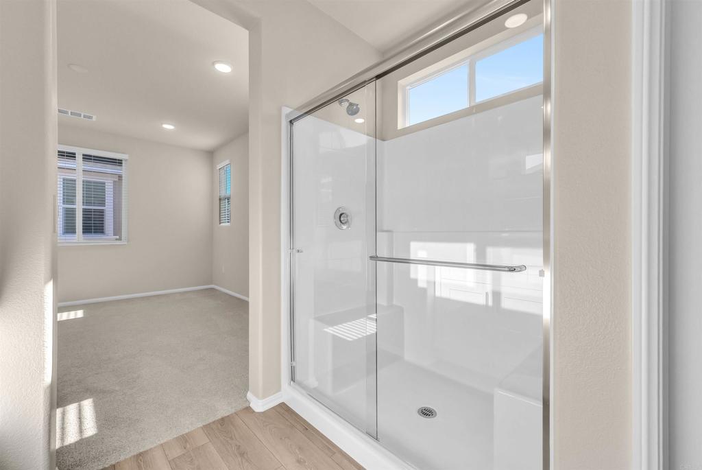 28381 Via Solero Temecula, CA 92591 - Photo 17 of 28 a bathroom with a glass shower door