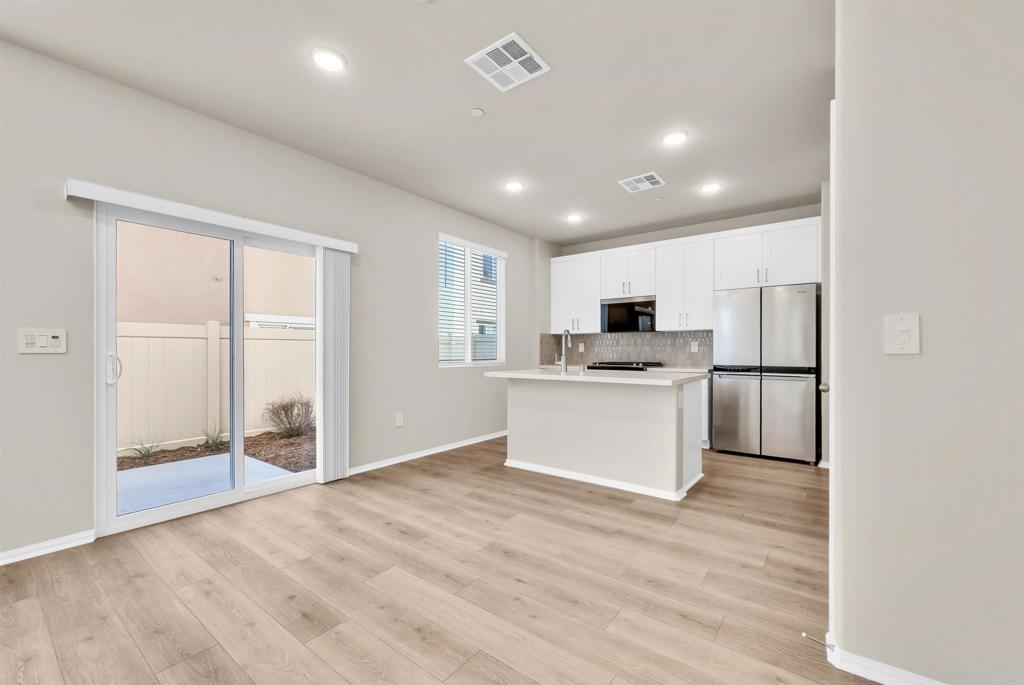 28381 Via Solero Temecula, CA 92591 - Photo 7 of 28 a view of kitchen with microwave and refrigerator
