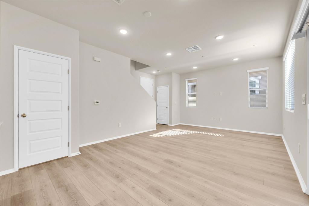 28381 Via Solero Temecula, CA 92591 - Photo 8 of 28 a view of an empty room with wooden floor