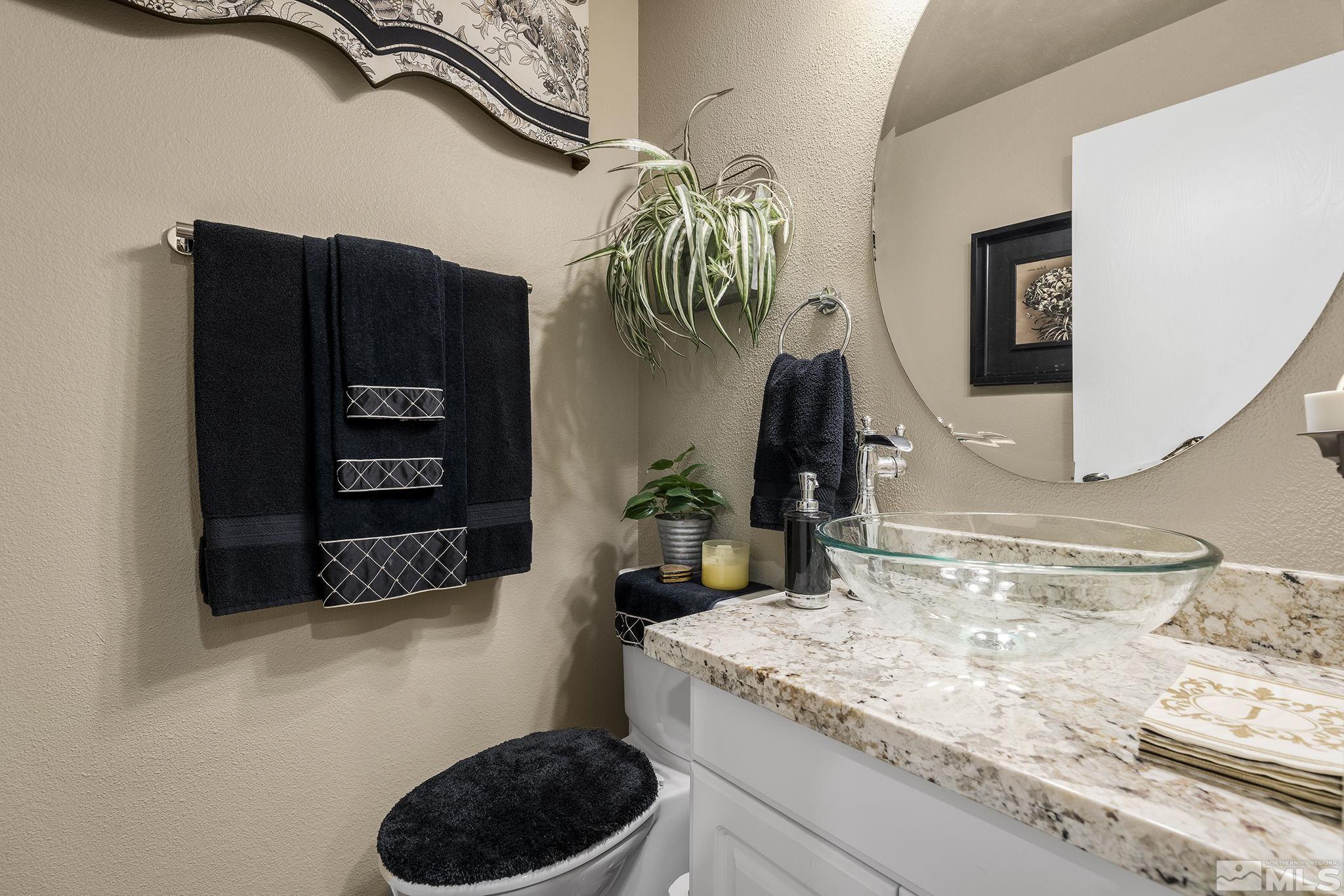 1947 South Villa Way Reno, NV 89509 - Photo 13 of 27 a bathroom with a sink and a mirror