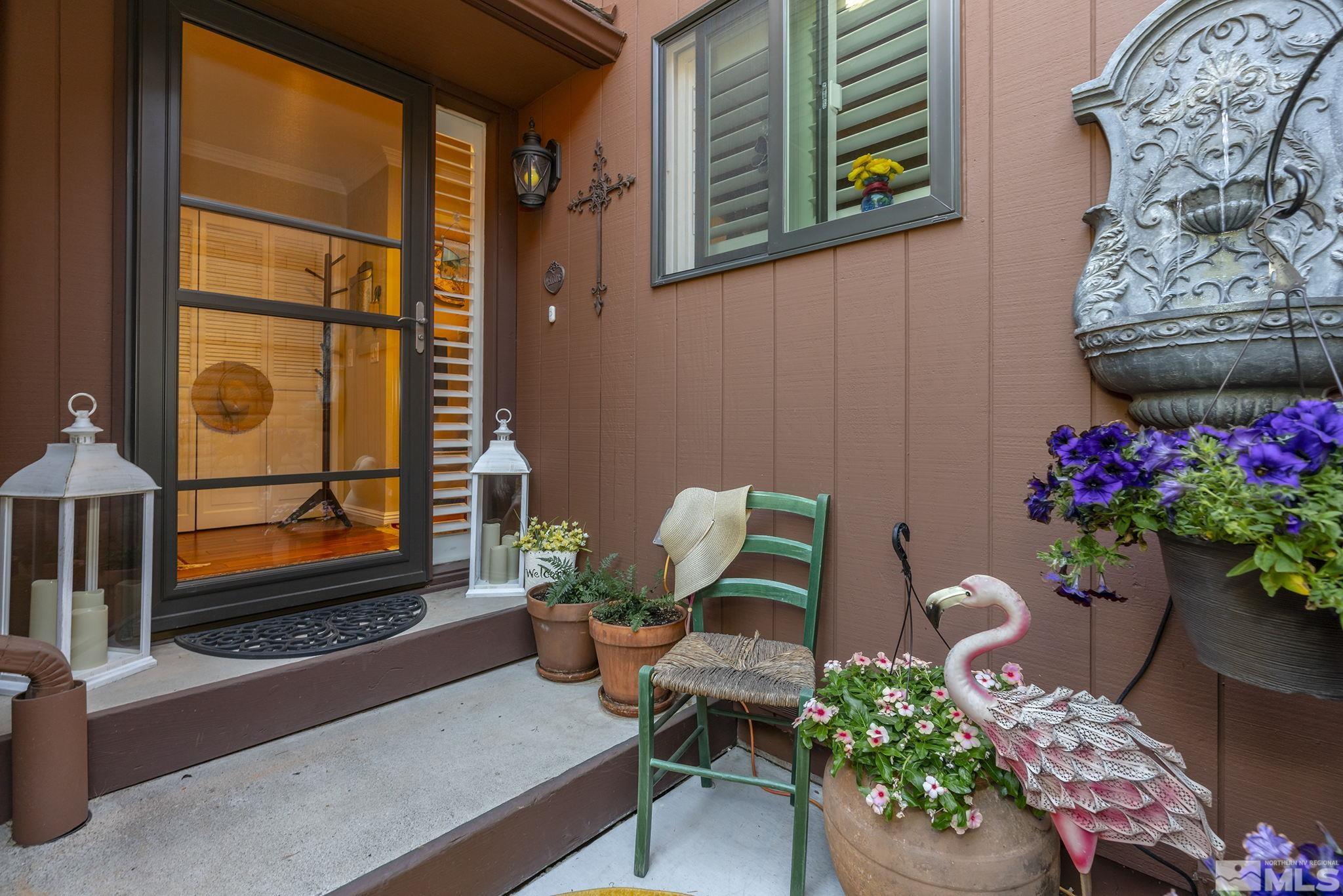1947 South Villa Way Reno, NV 89509 - Photo 2 of 27 a living room with furniture and flowers