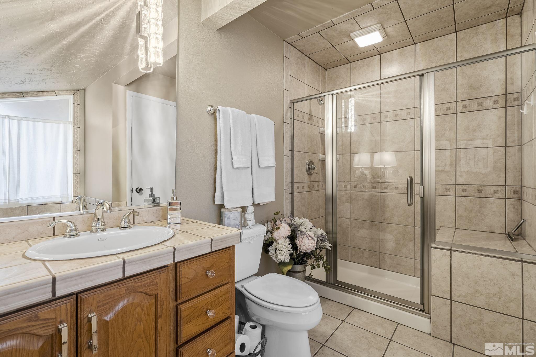 1947 South Villa Way Reno, NV 89509 - Photo 22 of 27 a bathroom with a sink toilet and shower