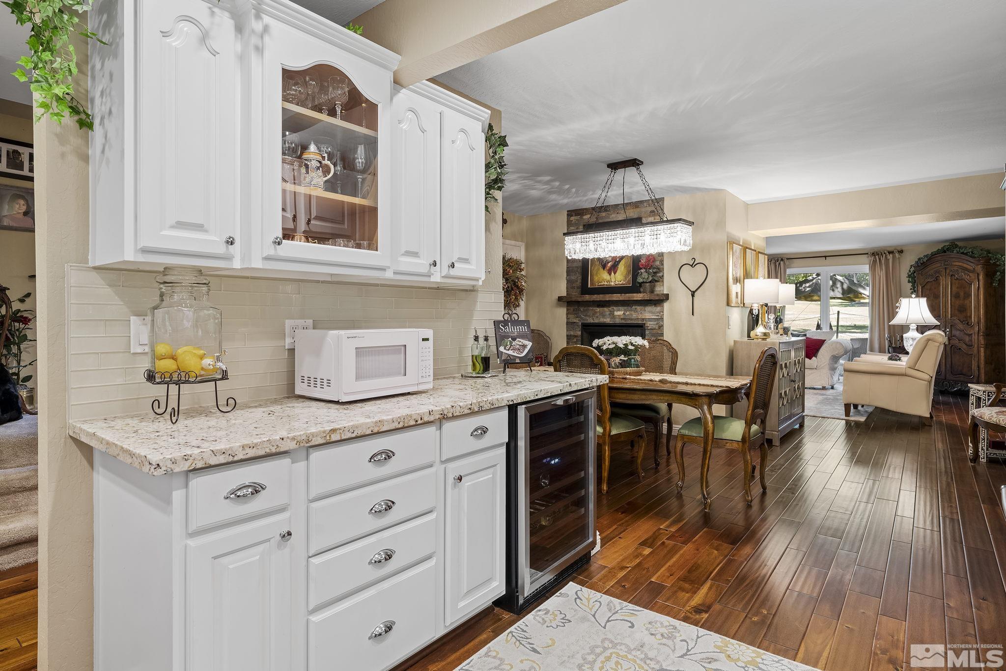 1947 South Villa Way Reno, NV 89509 - Photo 26 of 27 a kitchen with a stove a sink and dishwasher with wooden floor