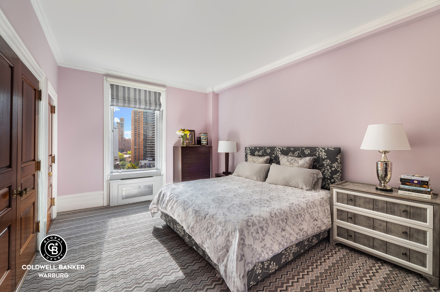 565 Park Avenue, Unit 11E Manhattan, NY 10065 - Photo 5 of 11 a bedroom with a bed and a table in it