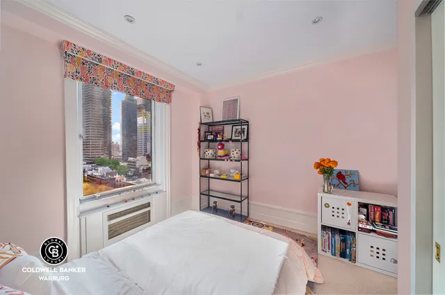 a bedroom with a bed and a table in it