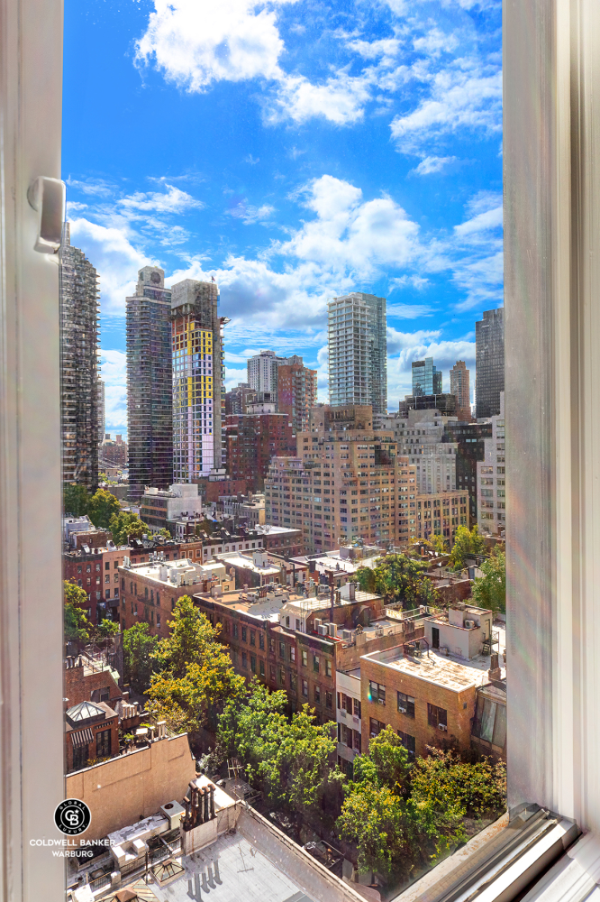 565 Park Avenue, Unit 11E Manhattan, NY 10065 - Photo 8 of 11 a view of a city with tall buildings