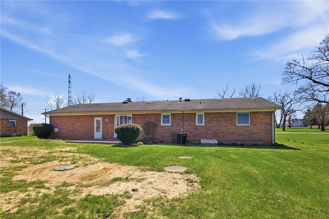 6718 Old Columbus Road South Vienna, OH 45369 - Photo 28 of 33 This residence showcases a classic brick exterior, providing both durability and a timeless aesthetic.