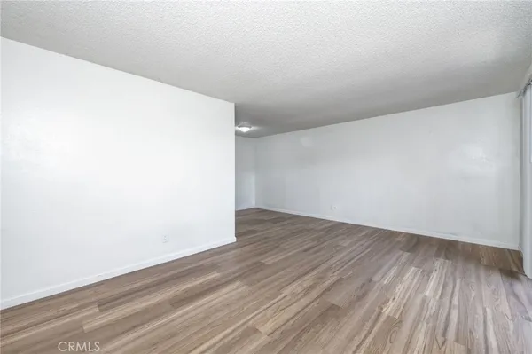 an empty room with wooden floor