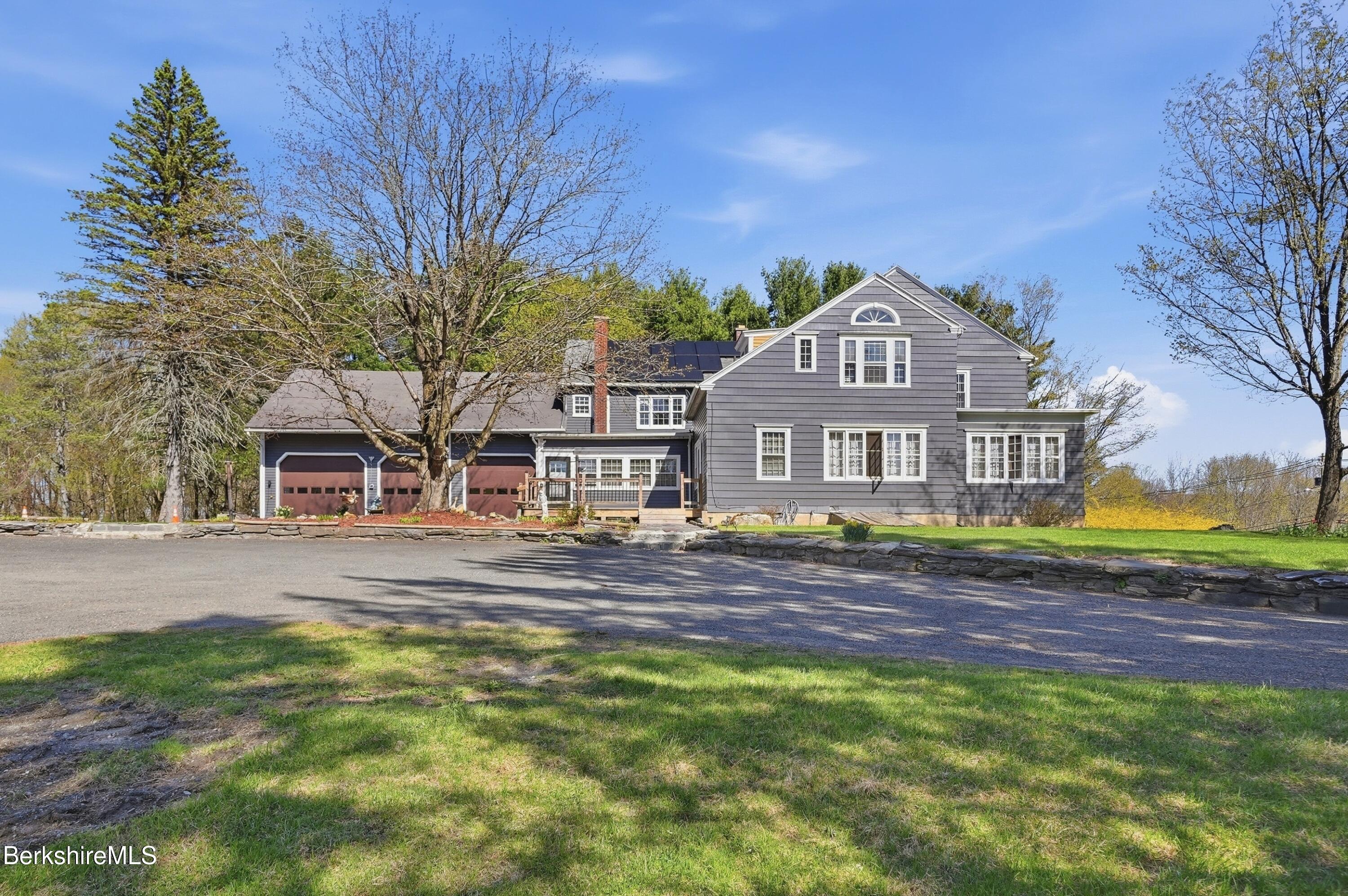752 State Road Richmond, MA 01254 - Photo 5 of 71 a front view of a house with a garden