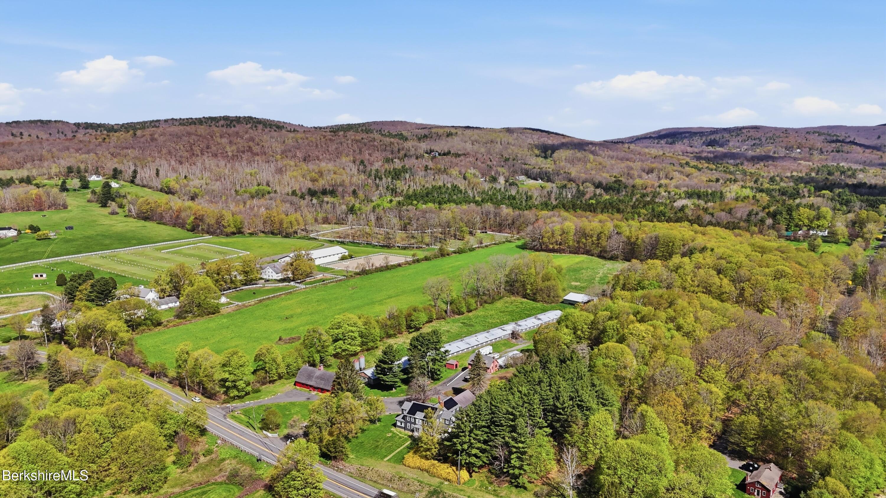 752 State Road Richmond, MA 01254 - Photo 54 of 71 a view of a lush green hillside and houses