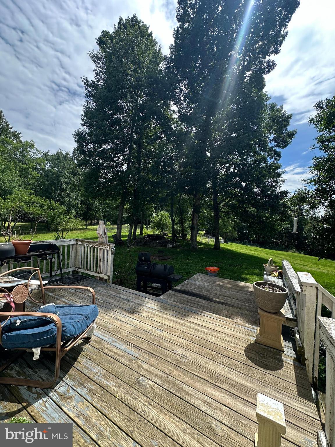 8470 Dunkard Church Road Rixeyville, VA 22737 - Photo 22 of 24 a view of a deck with chairs and wooden fence