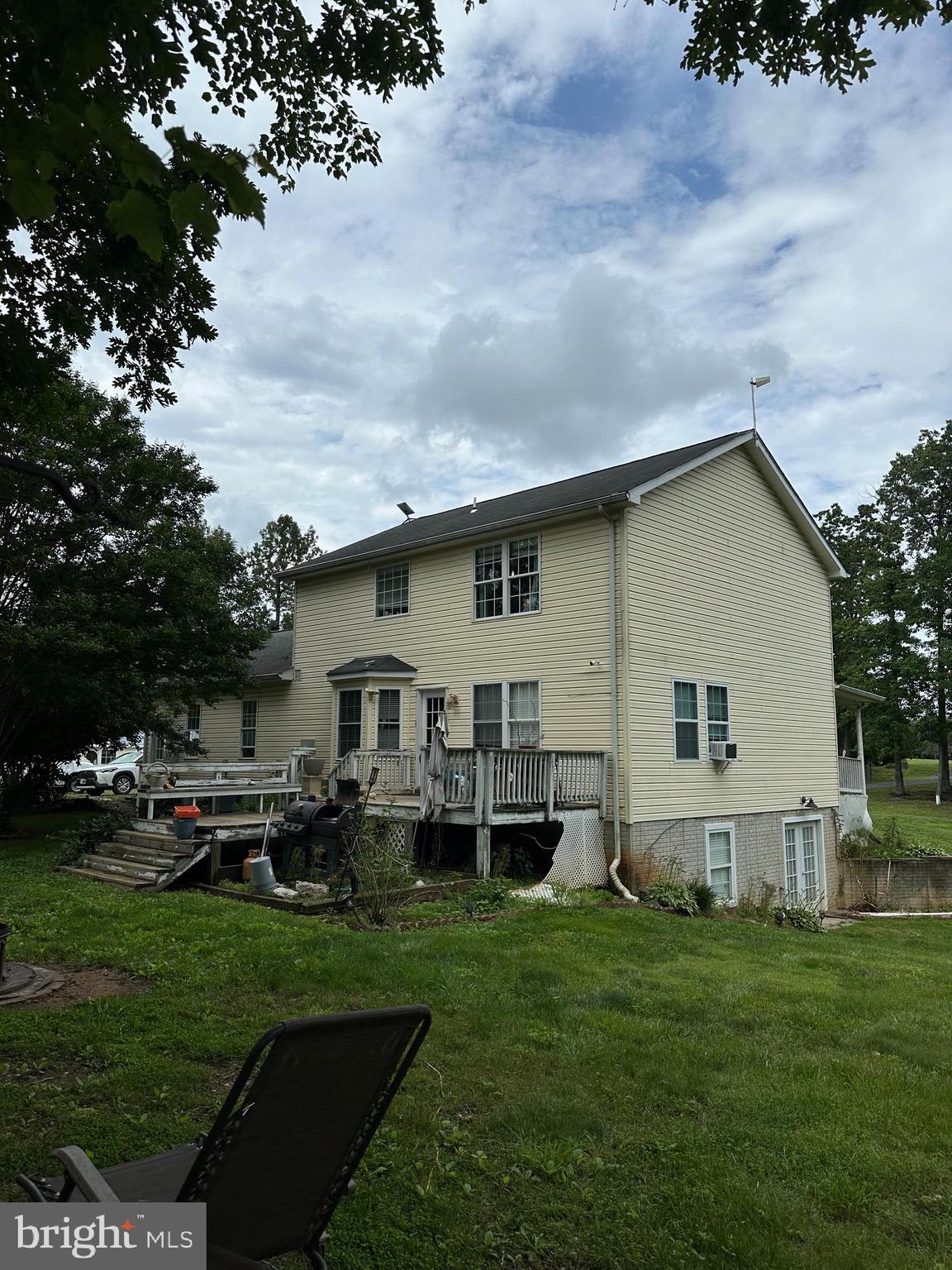 8470 Dunkard Church Road Rixeyville, VA 22737 - Photo 5 of 24 a view of a house with backyard sitting area and garden