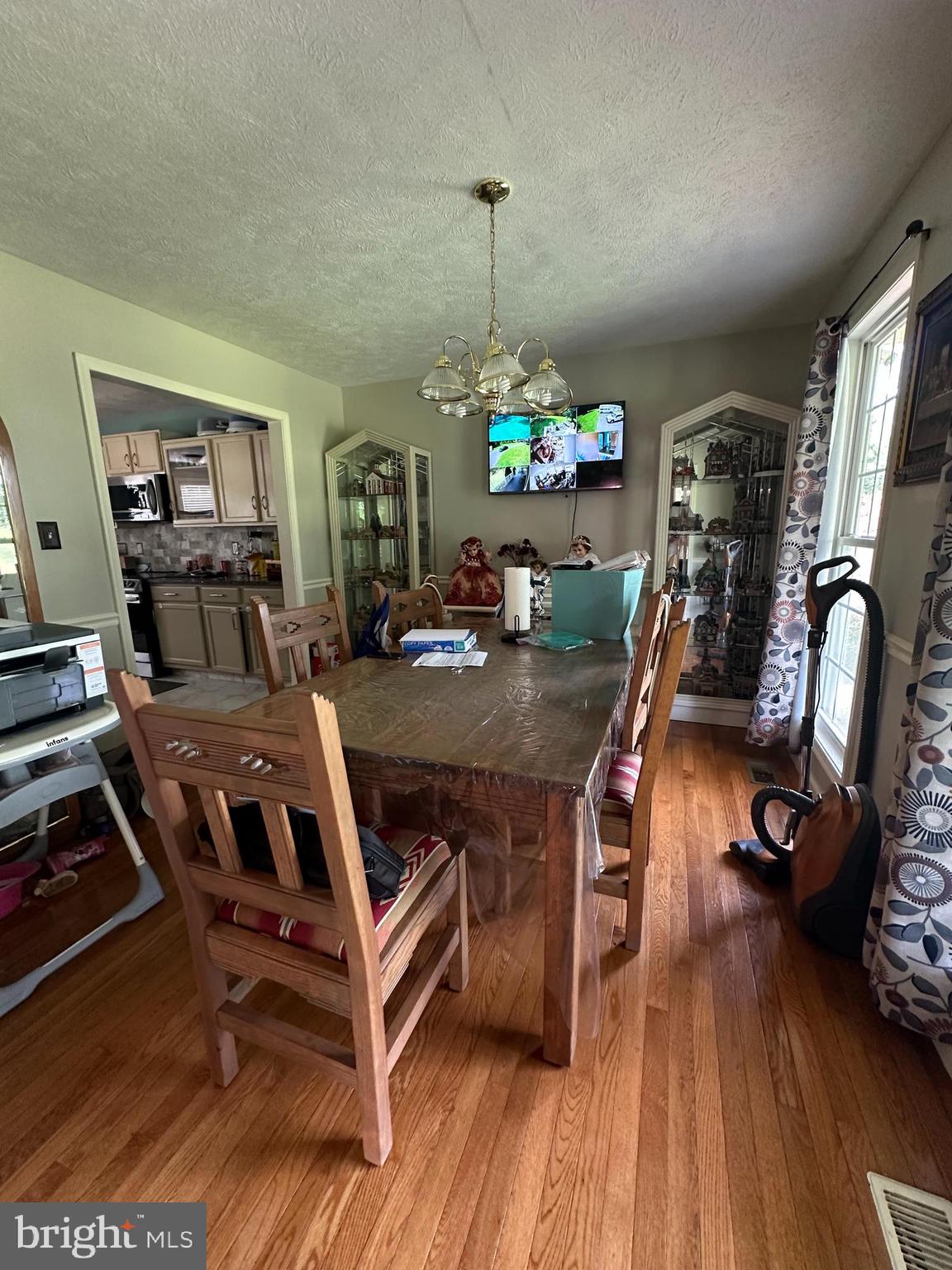8470 Dunkard Church Road Rixeyville, VA 22737 - Photo 6 of 24 a view of a dining room with furniture window and wooden floor