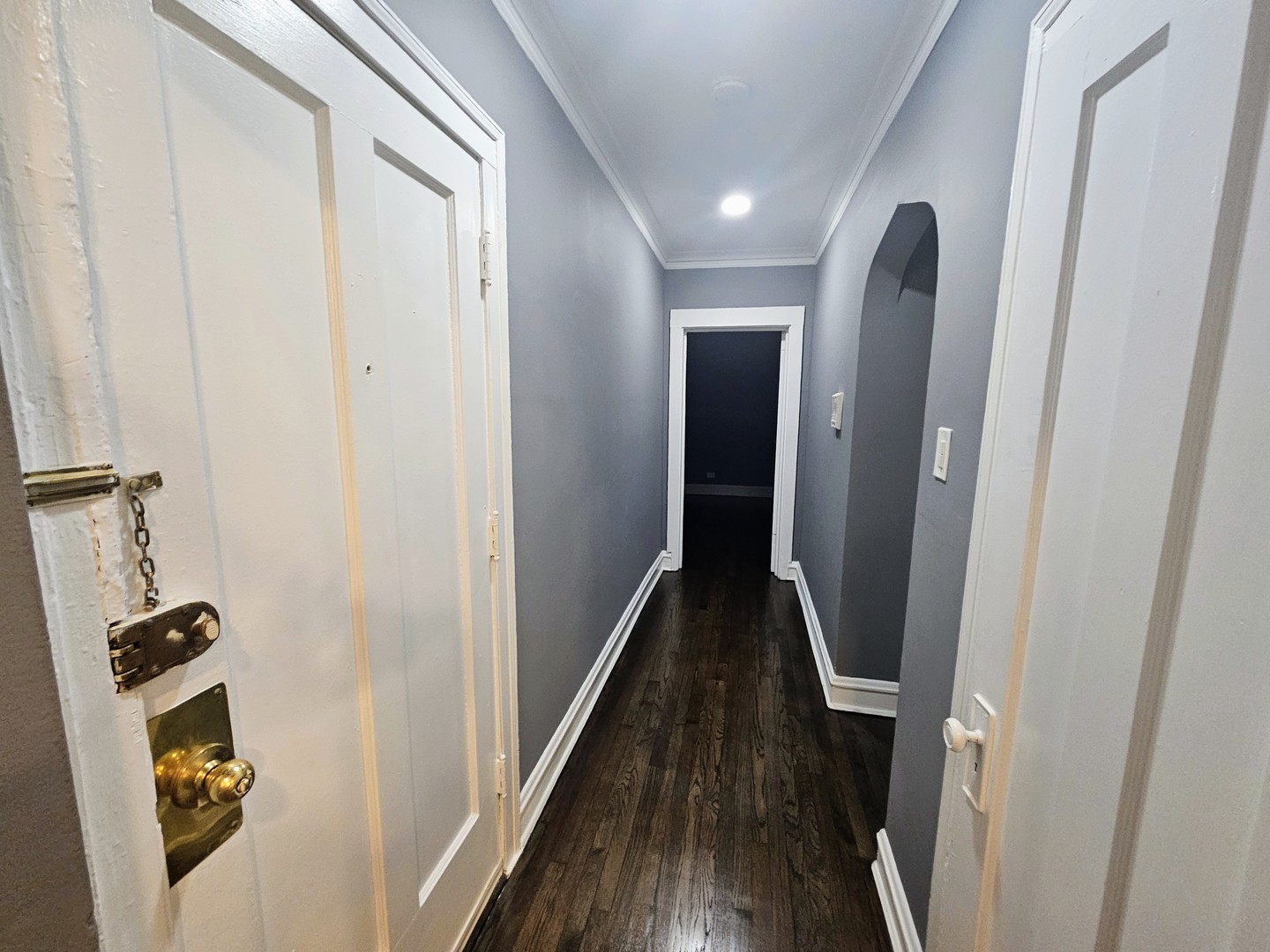 6545 North Francisco Avenue, Unit 1A Chicago, IL 60645 - Photo 2 of 12 a view of a hallway with wooden floor and staircase