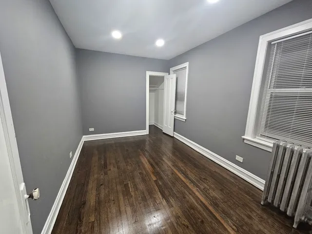 a view of wooden floor in an empty room