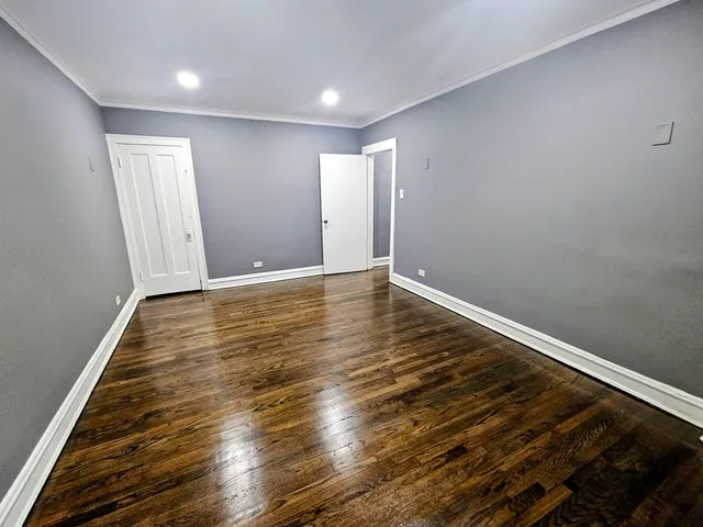 a view of room with wooden floor