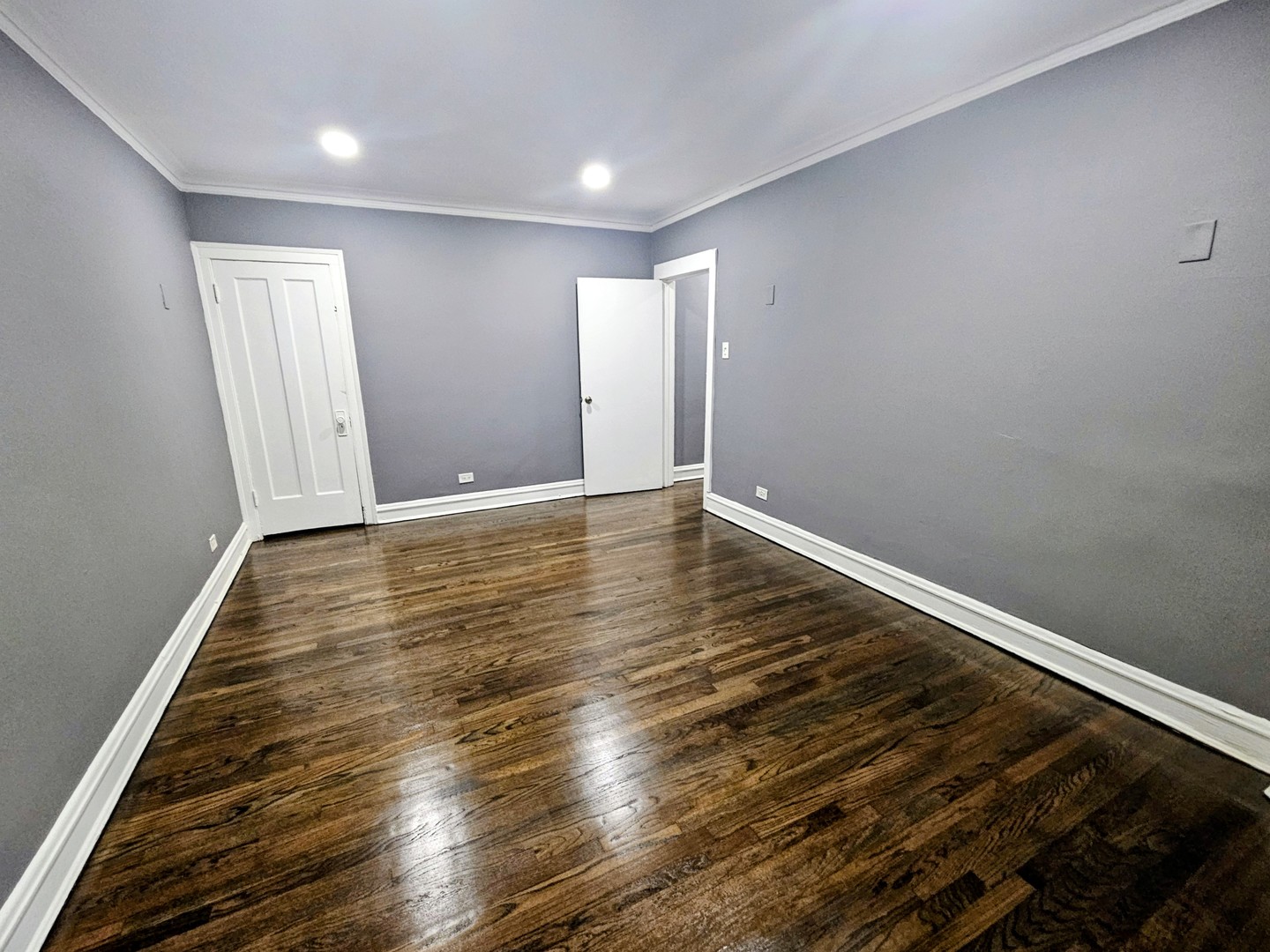 6545 North Francisco Avenue, Unit 1A Chicago, IL 60645 - Photo 9 of 12 a view of room with wooden floor