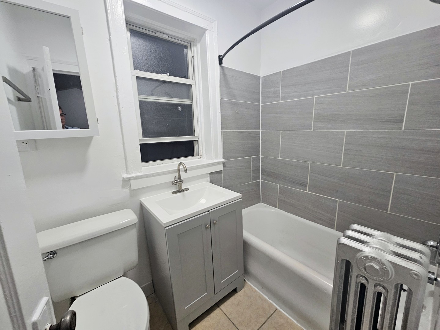 6545 North Francisco Avenue, Unit 1A Chicago, IL 60645 - Photo 10 of 12 a bathroom with a sink toilet and shower