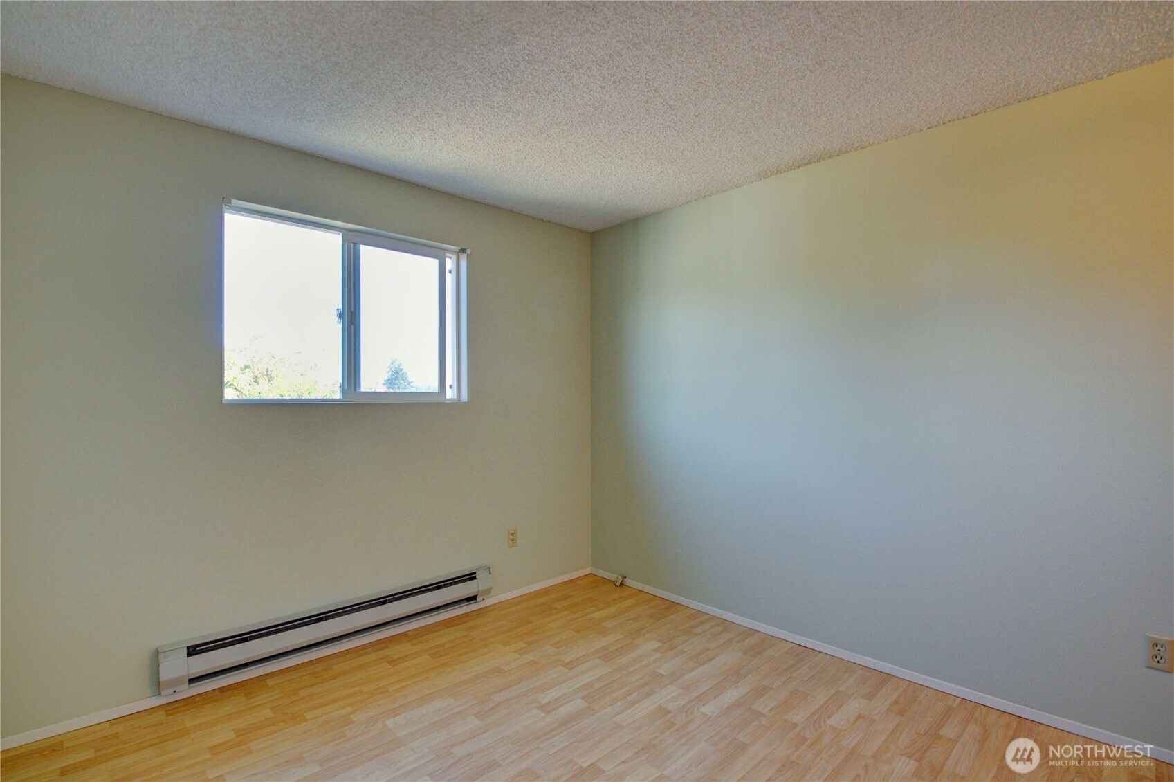 1214 36th Street Anacortes, WA 98221 - Photo 19 of 23 an empty room with a window