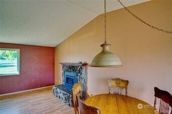 1214 36th Street Anacortes, WA 98221 - Photo 10 of 23 a bedroom with a bed and a dresser