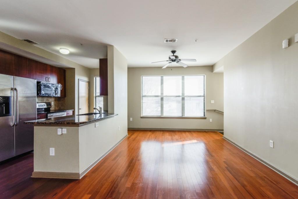 898 Oak Street Southwest, Unit 2004 Atlanta, GA 30310 - Photo 1 of 1 a view of a kitchen with wooden floor and a window