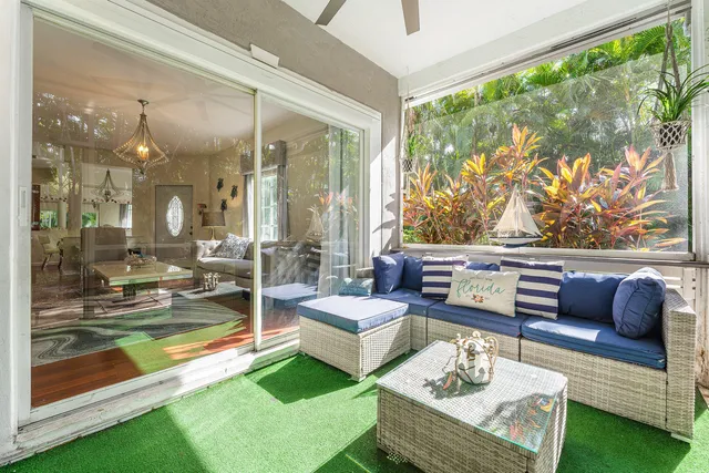 a living room with patio and a couch