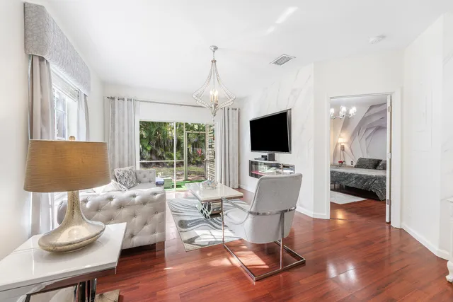 a living room with furniture fireplace and a flat screen tv