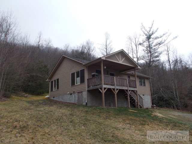 191 V L Moretz Road Deep Gap, NC 28618 - Photo 1 of 7 front view of a house with a yard