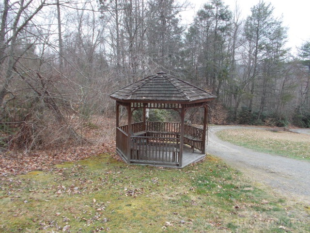 191 V L Moretz Road Deep Gap, NC 28618 - Photo 3 of 7 a front view of a house with a yard