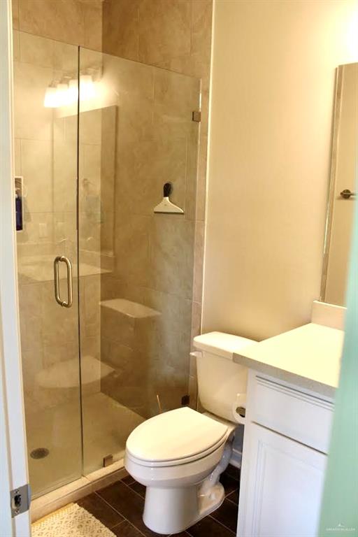 708 South Tecate Drive Mission, TX 78572 - Photo 7 of 10 a white toilet sitting next to a bathroom sink