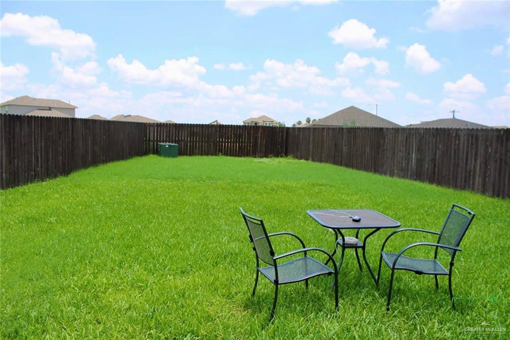 708 South Tecate Drive Mission, TX 78572 - Photo 8 of 10 a view of a table and chairs in backyard