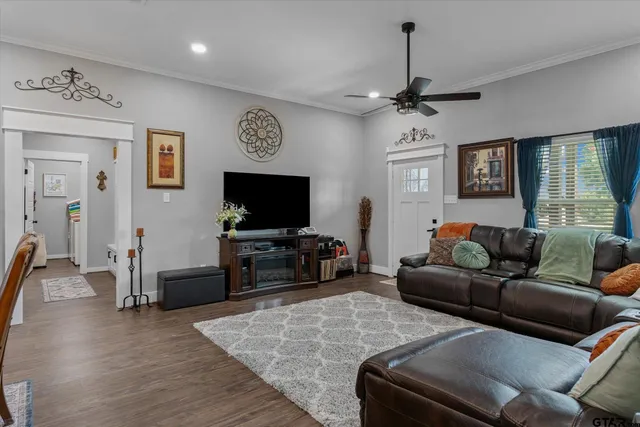 a living room with furniture and a flat screen tv
