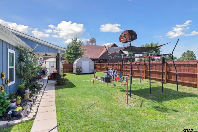 a view of a porch with a table and chairs